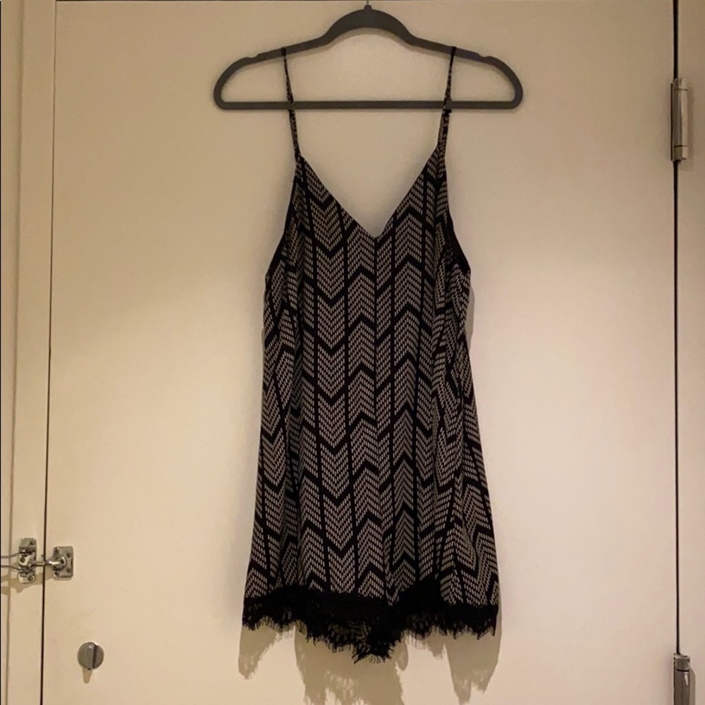Black and white baby doll romper with lace trim